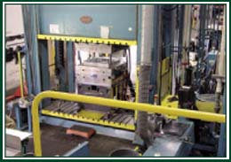 800 ob/hr CPI Advantage T D-LFT In-Line Compounding System with a 1,500-Ton Compression Press feeding a Shear-Edge Compression Mold